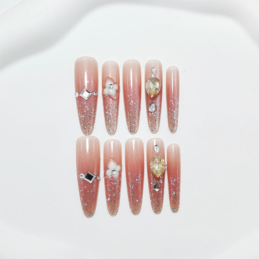 Shiny artificial nails with rhinestones and glitter Bowlift