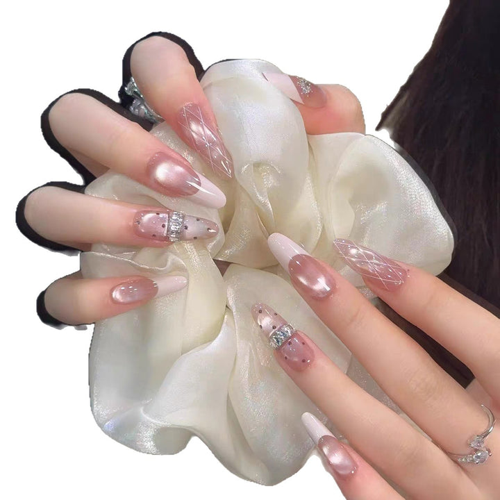 Elegant Stiletto Nail Art Extensions with Decorative Accents Bowlift