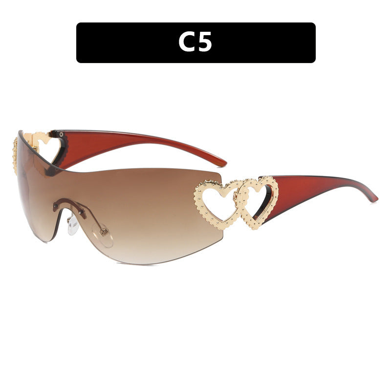 Ladies sporty sunglasses in trendy shield design with heart accents Bowlift