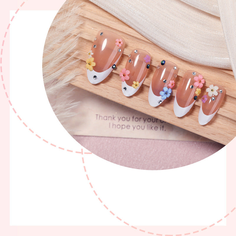 Artificial nail set with delicate floral decorations and sparkling rhinestones Bowlift
