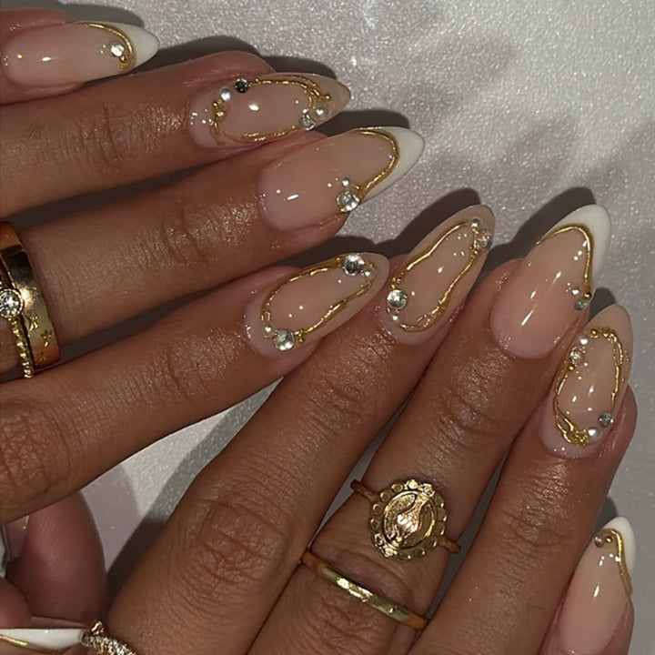 Artistic Nail Art with Elegant Gold Accents Bowlift