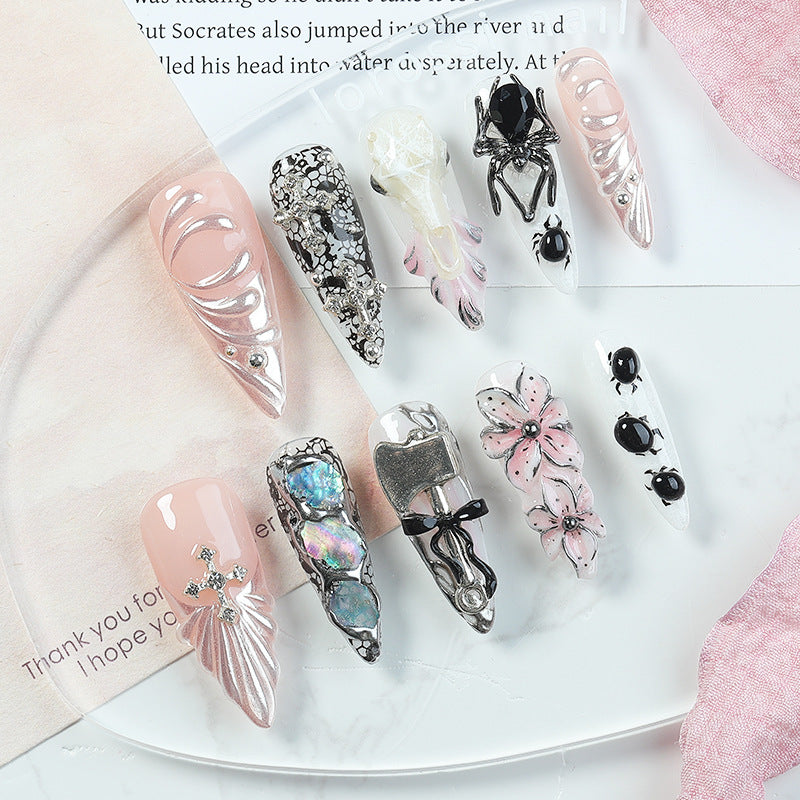 Creative nail art set with Halloween motifs and intricate details Bowlift