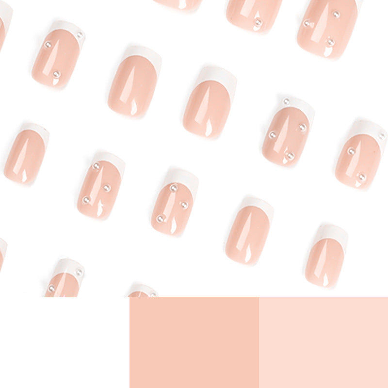 Artful nail art with elegant pearl and glitter accents Bowlift