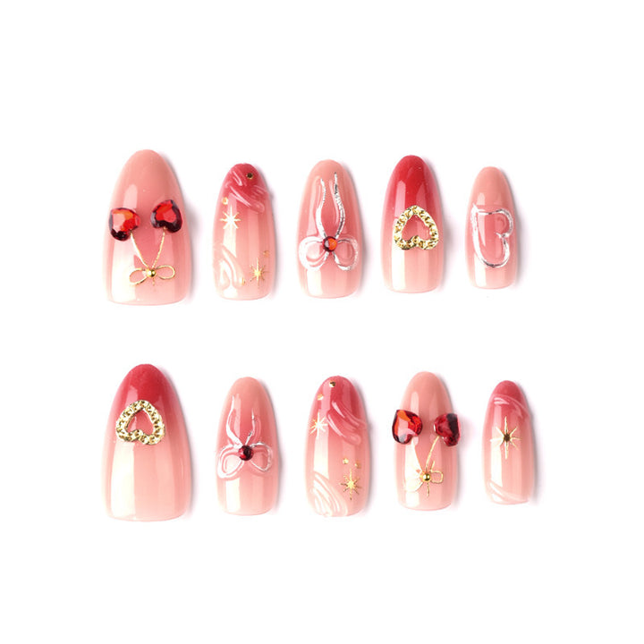 Decorative artificial nails with romantic heart and bow motifs Bowlift