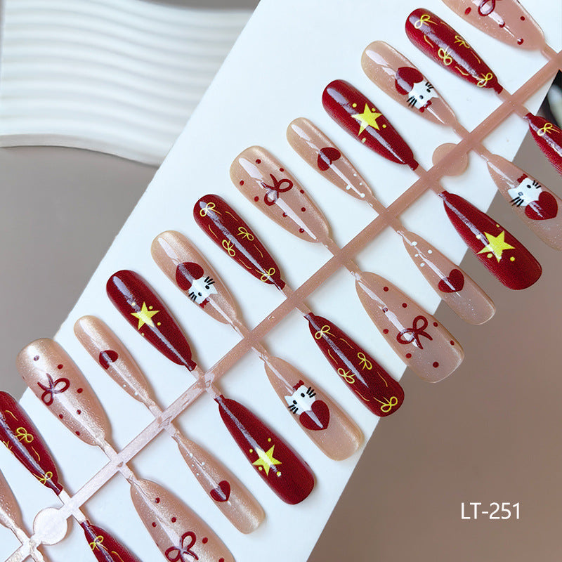 Artificial nails in festive Christmas design Bowlift