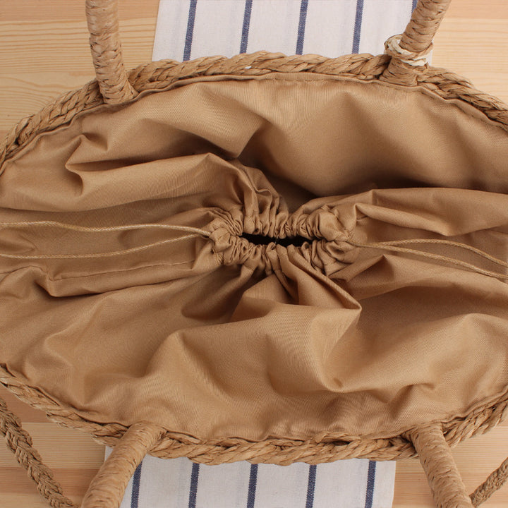Braided crossbody bag with tassel decoration Bowlift