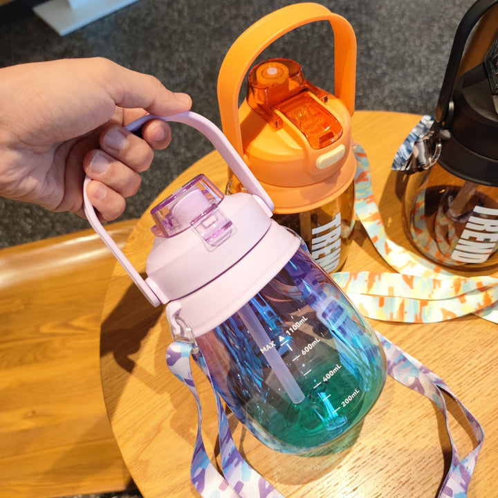 Women's multifunctional water bottle with safety closure and ergonomic carrying handle Bowlift