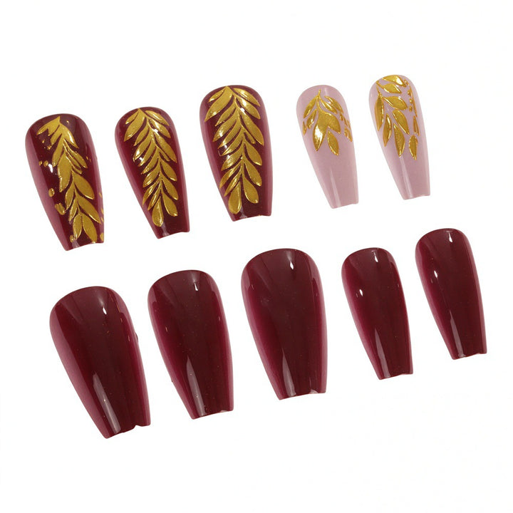 Elegant artificial nails with gold decoration Bowlift