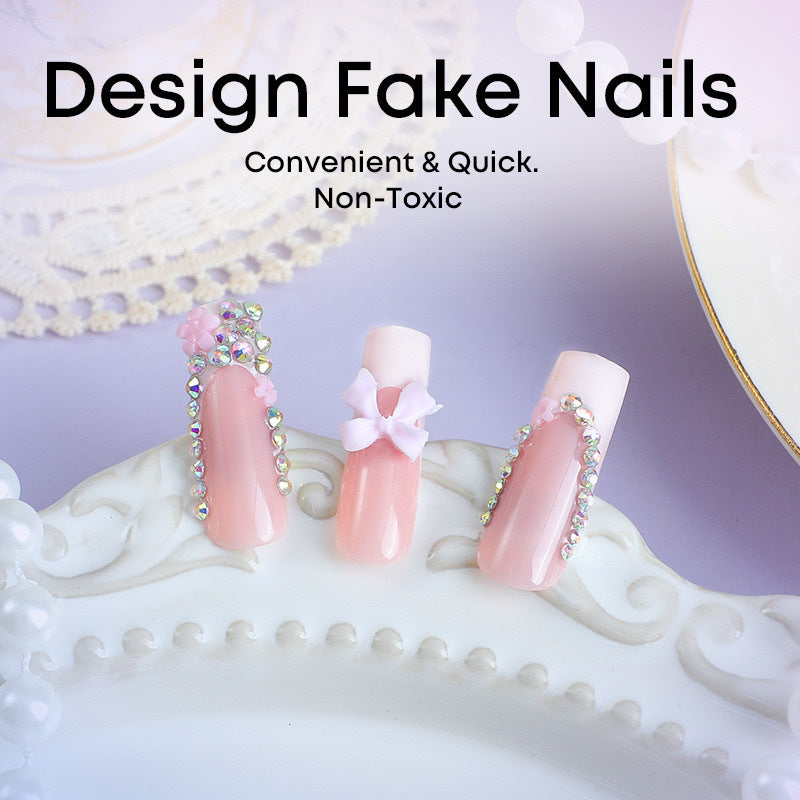 Artificial nail set with careful ribbon and glitter decorations Bowlift