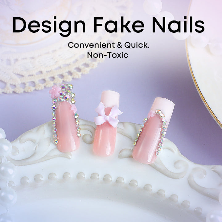 Artificial nail set with careful ribbon and glitter decorations Bowlift