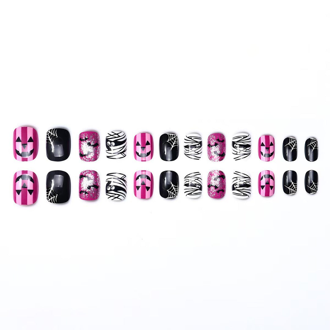 Creative nail art set with Halloween motifs and glitter accents Bowlift