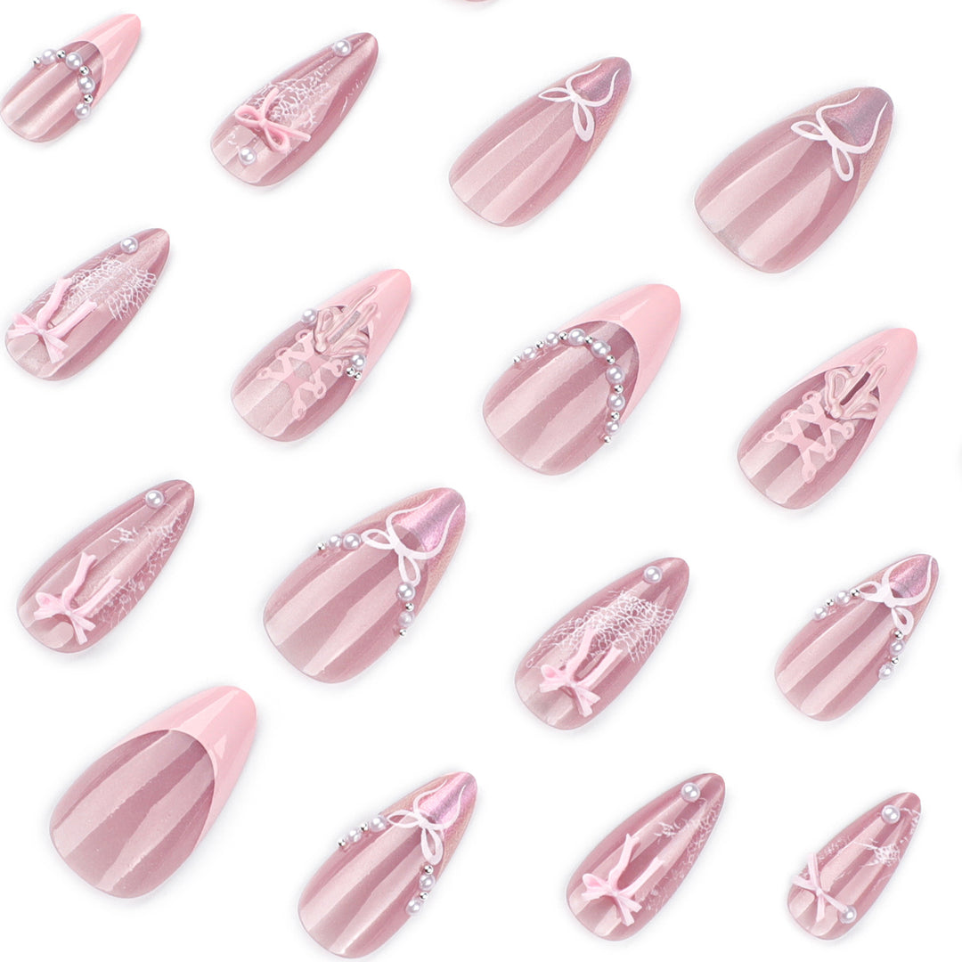 Artful nail extensions with delicate bow motifs Bowlift