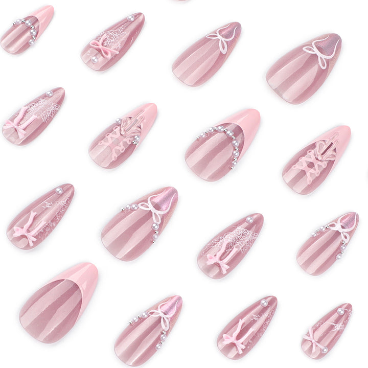 Artful nail extensions with delicate bow motifs Bowlift