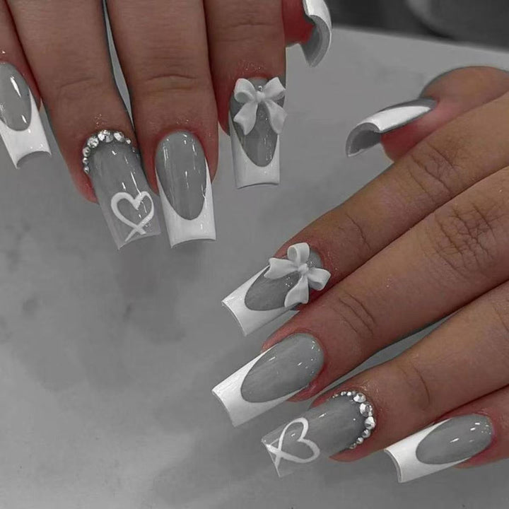 Artificial nail set with elegant bow and glitter decorations Bowlift