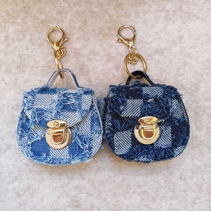 Distressed denim micro crossbody mini purse with gold turn-lock top handle Bowlift