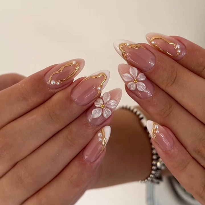 Artful acrylic nails with elegant floral accents Bowlift