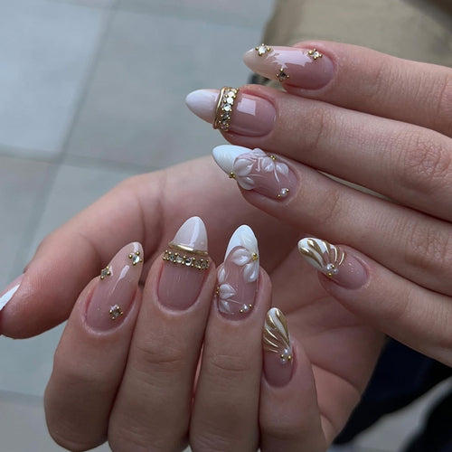 Artful nail art with floral and rhinestone accents Bowlift