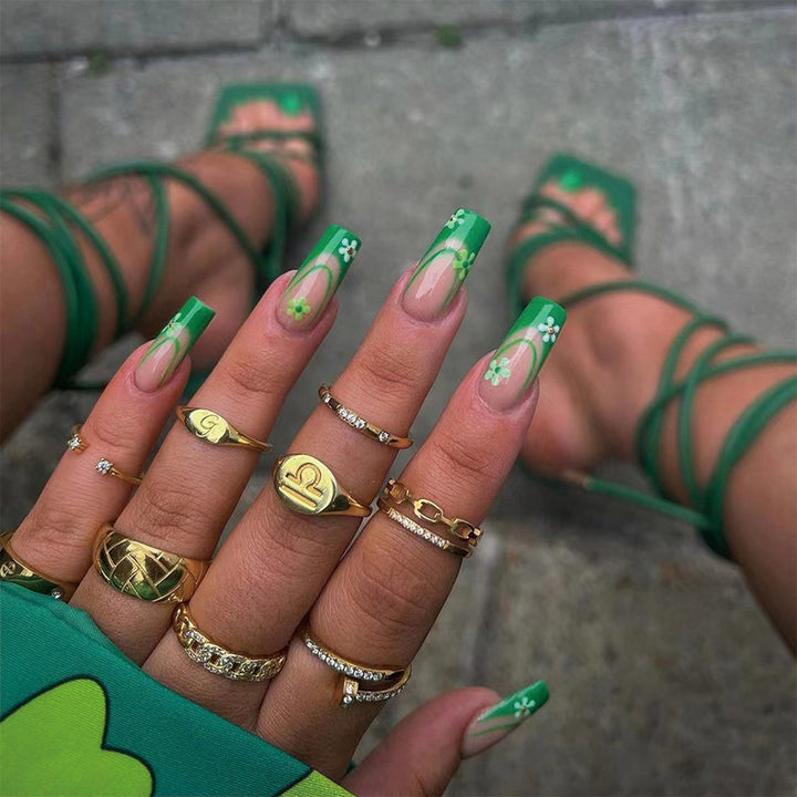 Artful nail art with floral accents and elegant design Bowlift