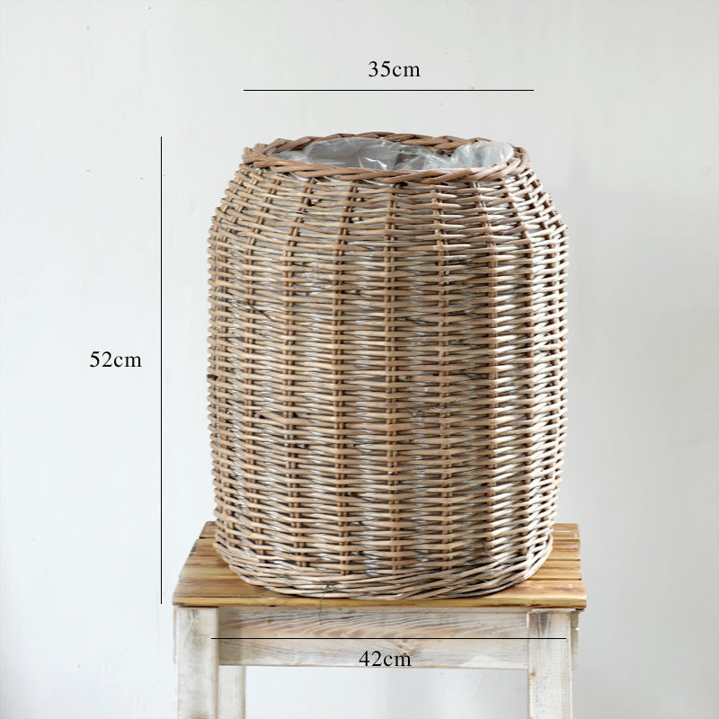 Stylish laundry basket made of braided natural material Bowlift