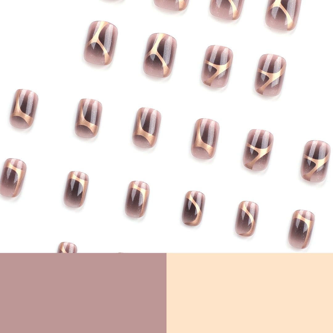 Artificial nail art with elegant metallic design and glitter accents Bowlift