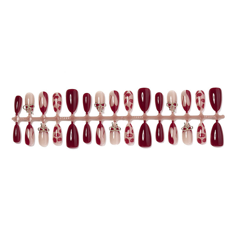 Artificial nail set with elegant bow and lip designs Bowlift