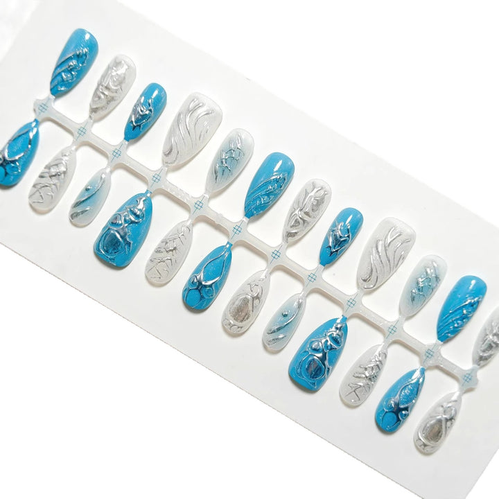 Creative artificial nails with shiny silver and turquoise tones Bowlift