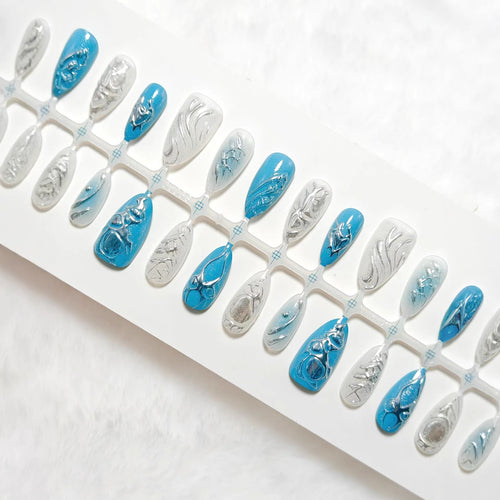Creative artificial nails with shiny silver and turquoise tones Bowlift
