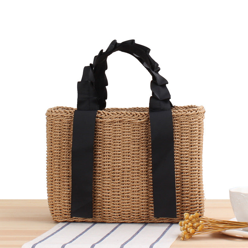 Playful basket bag with elegant fabric handle Bowlift
