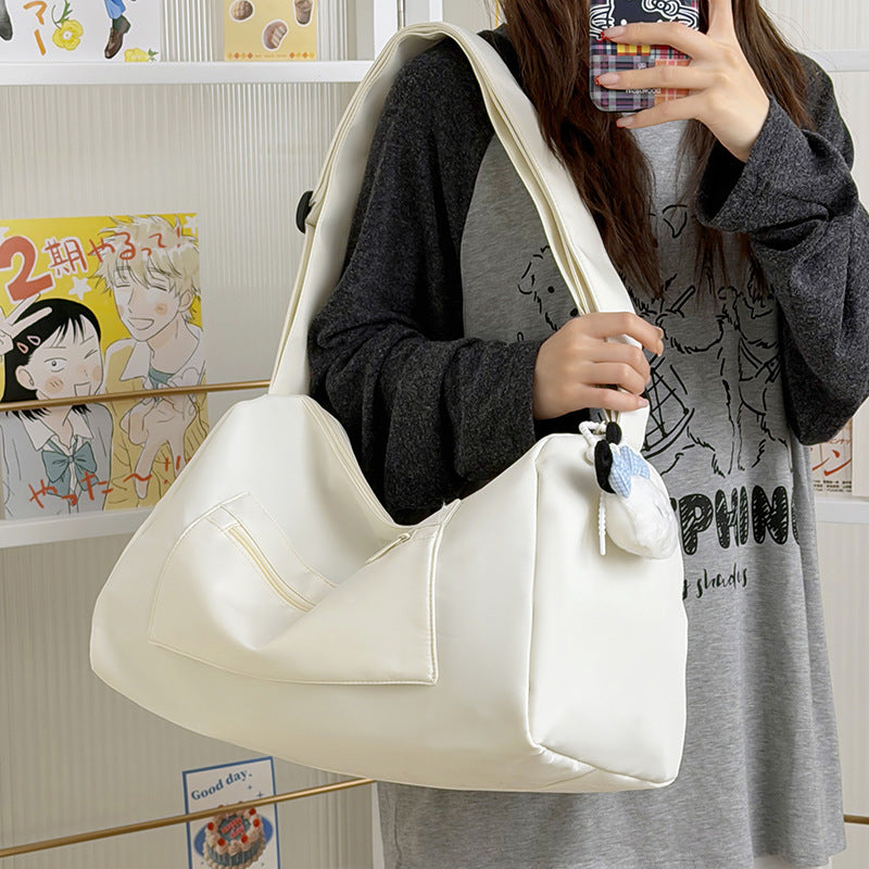 Sporty shoulder bag with spacious interior and sturdy carrying strap Bowlift