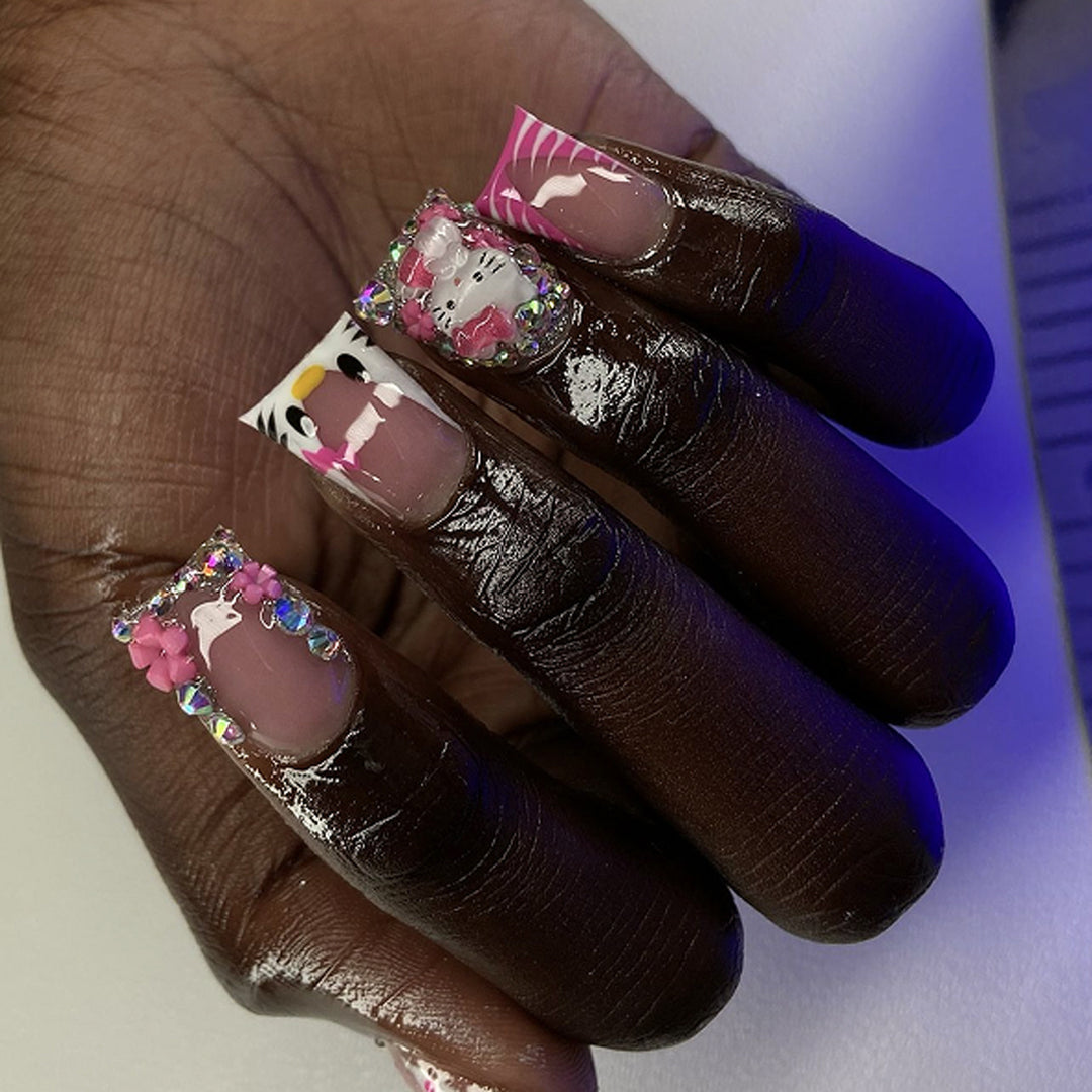 Artistic Nail Art with Animal Motifs and Glitter Accents Bowlift
