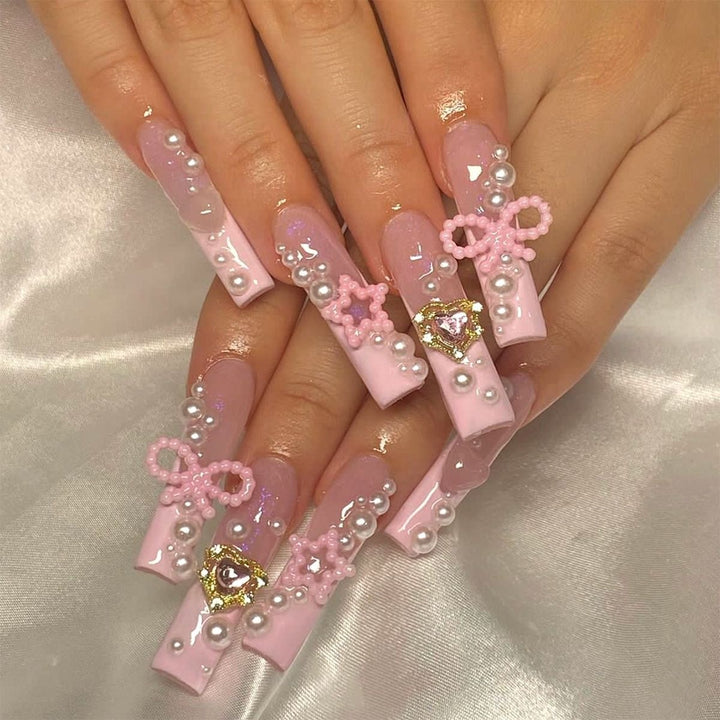 Creative acrylic nail set with delicate pearl and gloss accents Bowlift