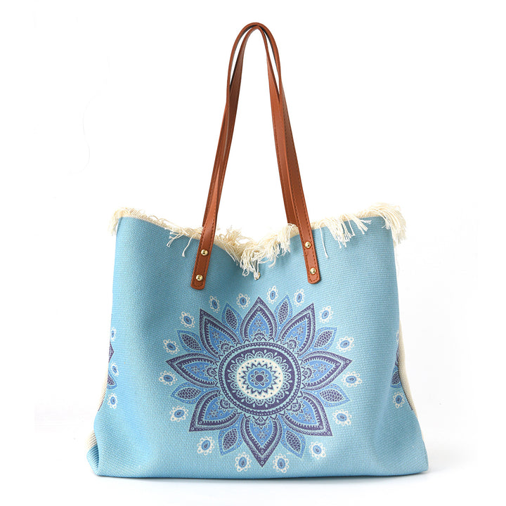 Beach bag with floral pattern and fringes Bowlift