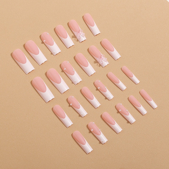 Artistic nail extensions with pearls and bows decorations Bowlift