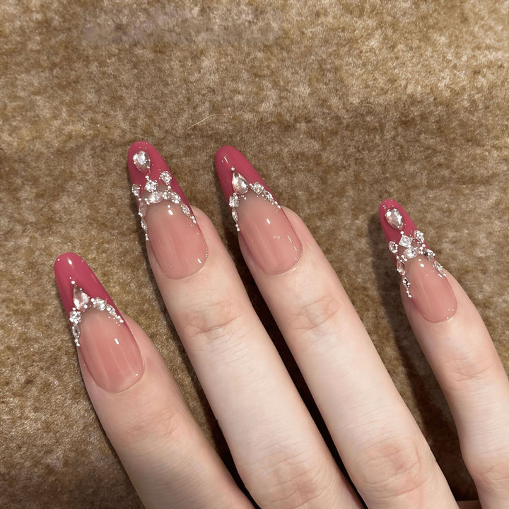 Artificial nails with sparkling rhinestone accents Bowlift