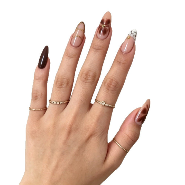 Artificial nails with elegant marble pattern and delicate accents Bowlift