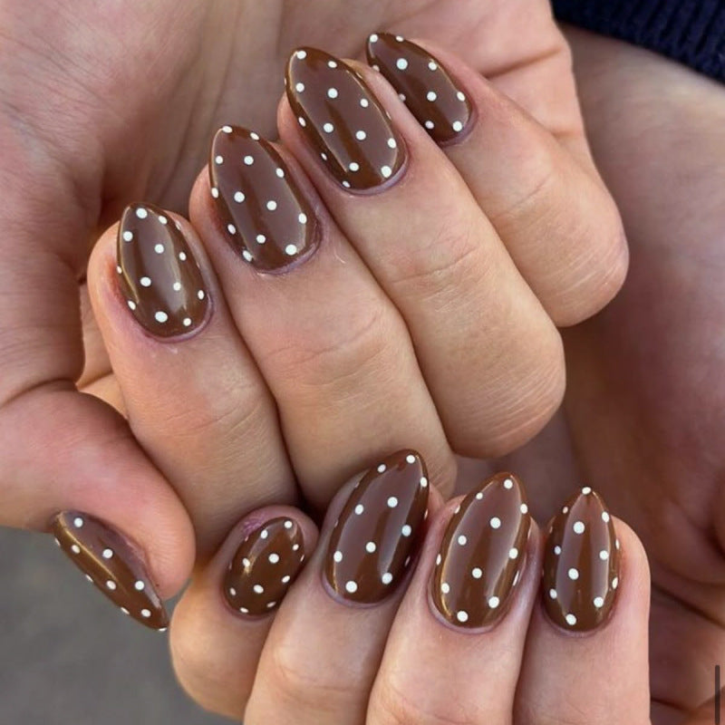 Artificial nail art with playful dots and bows Bowlift