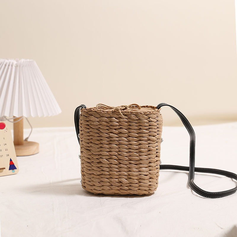Bag made of woven natural material with sparkling appliqués Bowlift