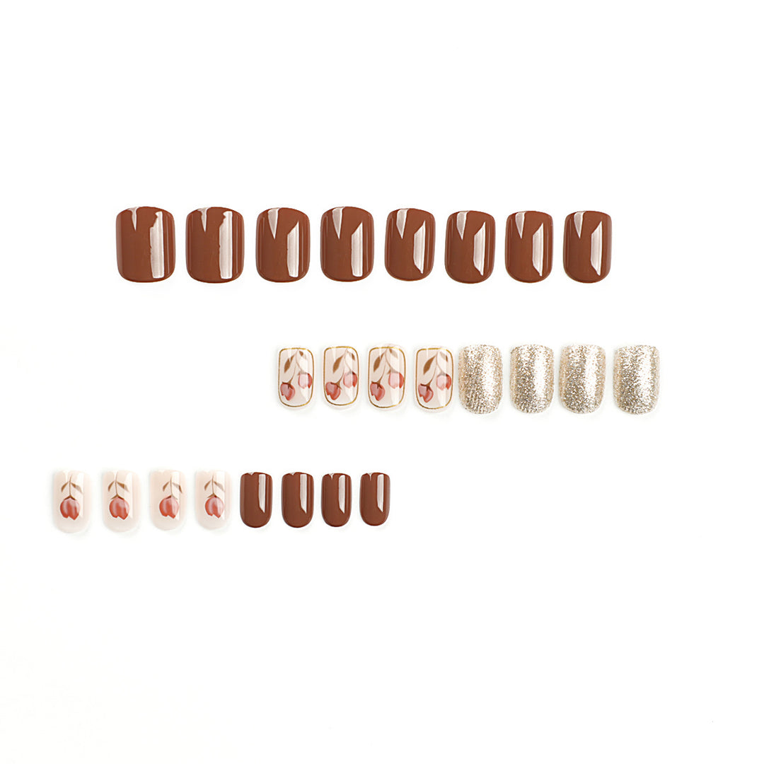 Artificial nail art with colorful flower design and glitter accents Bowlift