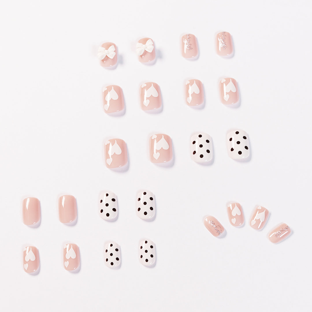 Artful nail art with delicate flower and heart motifs Bowlift