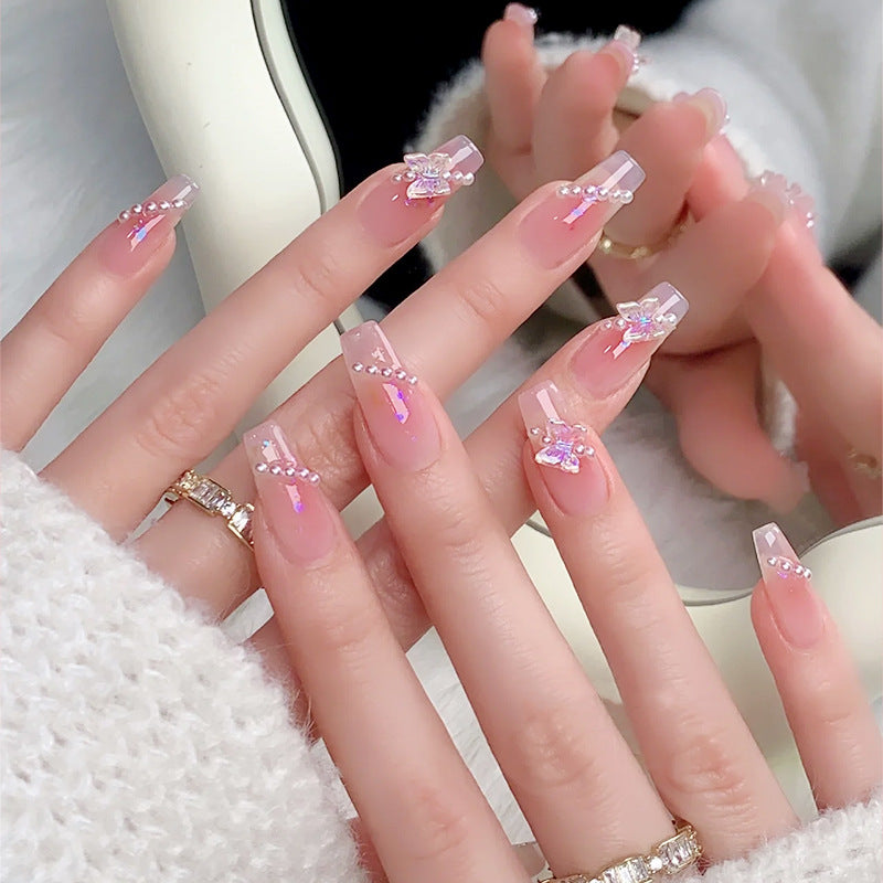 Artificial nails with luxurious pearl and glitter decorations Bowlift