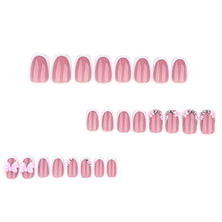 Artful nail extensions with sparkling accents and bow decorations Bowlift