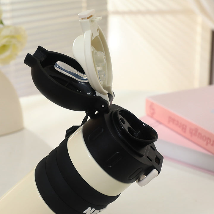 Insulated drinking bottle with a cute character design and practical carrying strap Bowlift