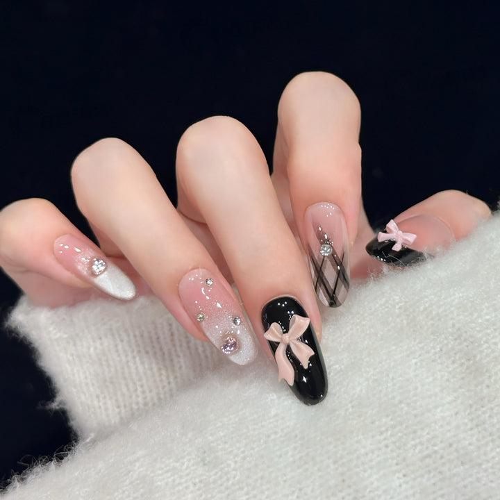Artificial nail tips with elegant bows and glitter details Bowlift