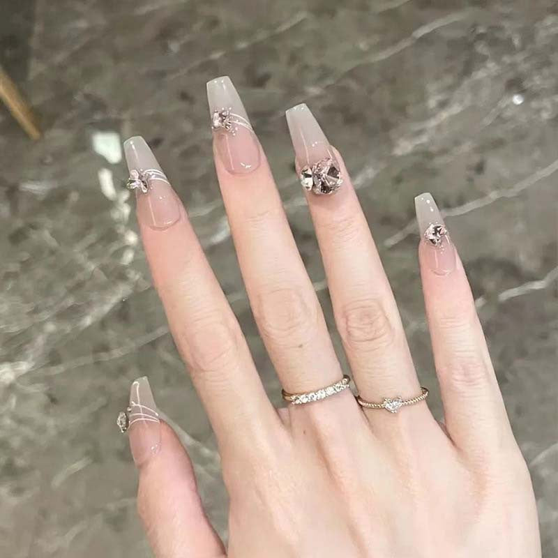 Art nail set with filigree decorations and glamorous accents Bowlift