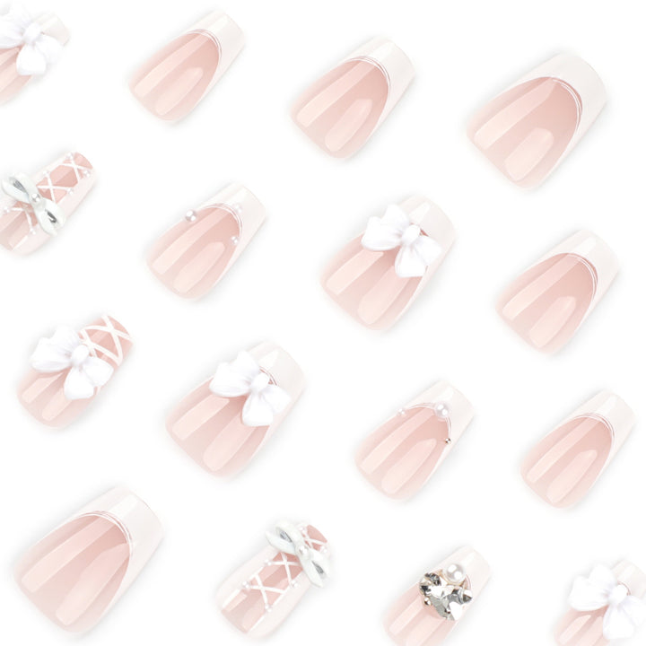 Artful Nail Art with Bows and Rhinestone Decorations Bowlift