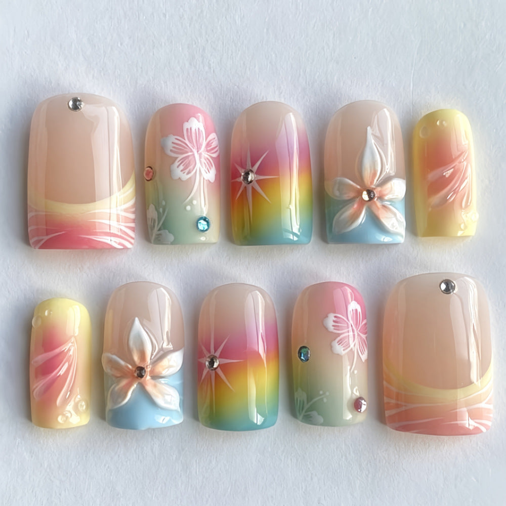 Acrylic nails with floral accents and gradient Bowlift