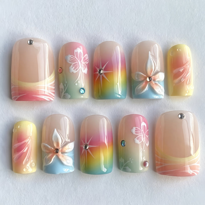 Acrylic nails with floral accents and gradient Bowlift