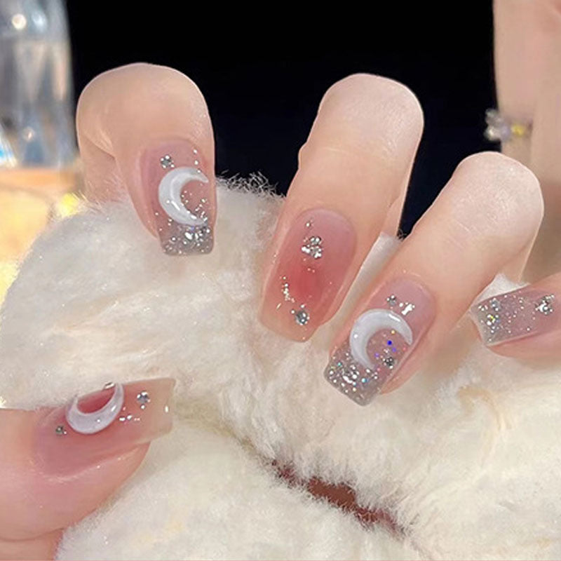 Glamorous artificial nails with delicate flower and glitter effects Bowlift