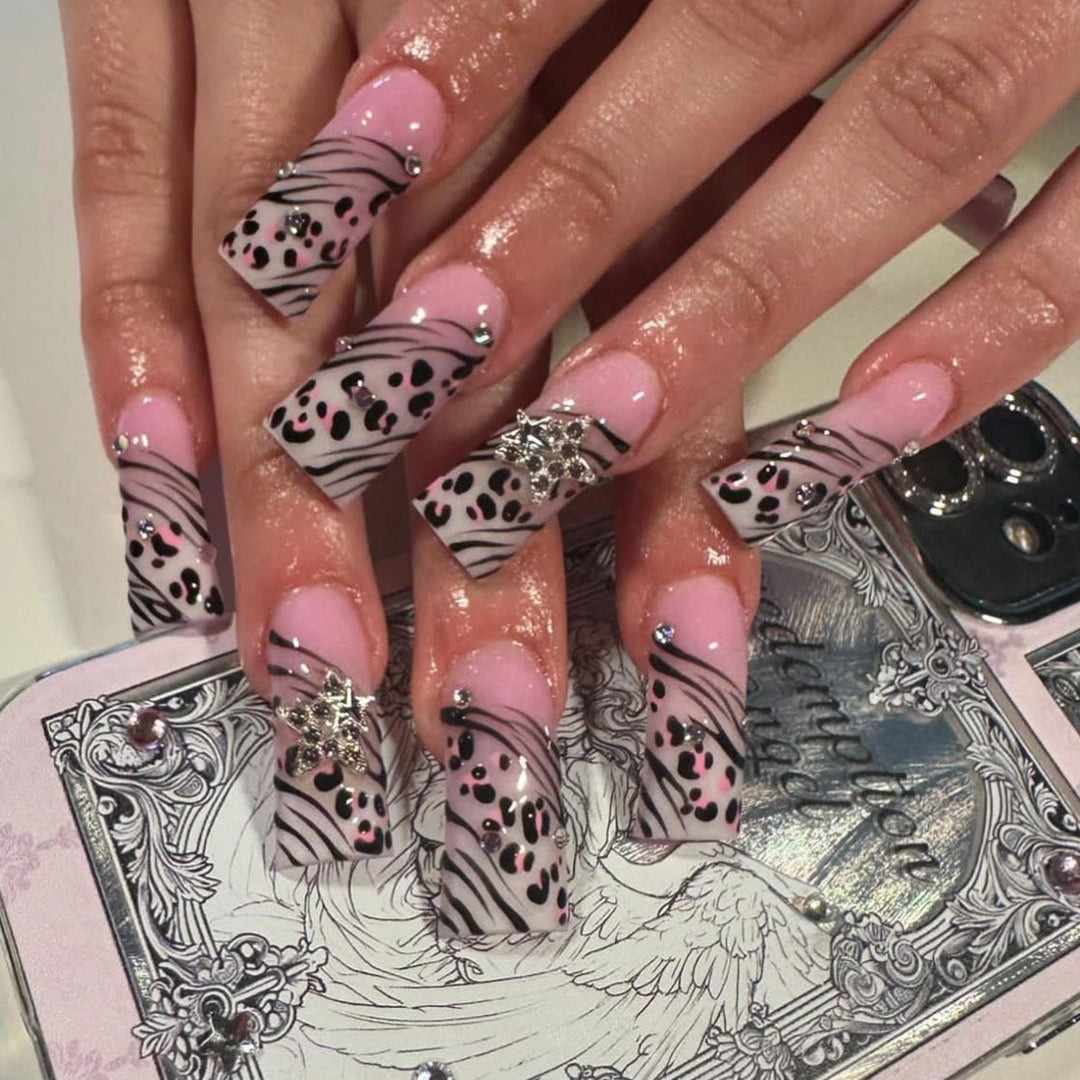 Artful Nail Art with Zebra Pattern and Glitter Accents Bowlift