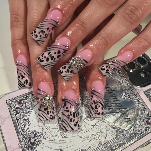 Artful Nail Art with Zebra Pattern and Glitter Accents Bowlift
